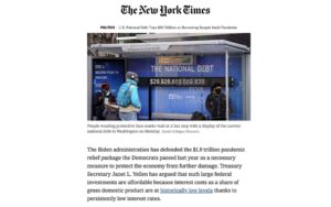 New York Times article with debt clock photo